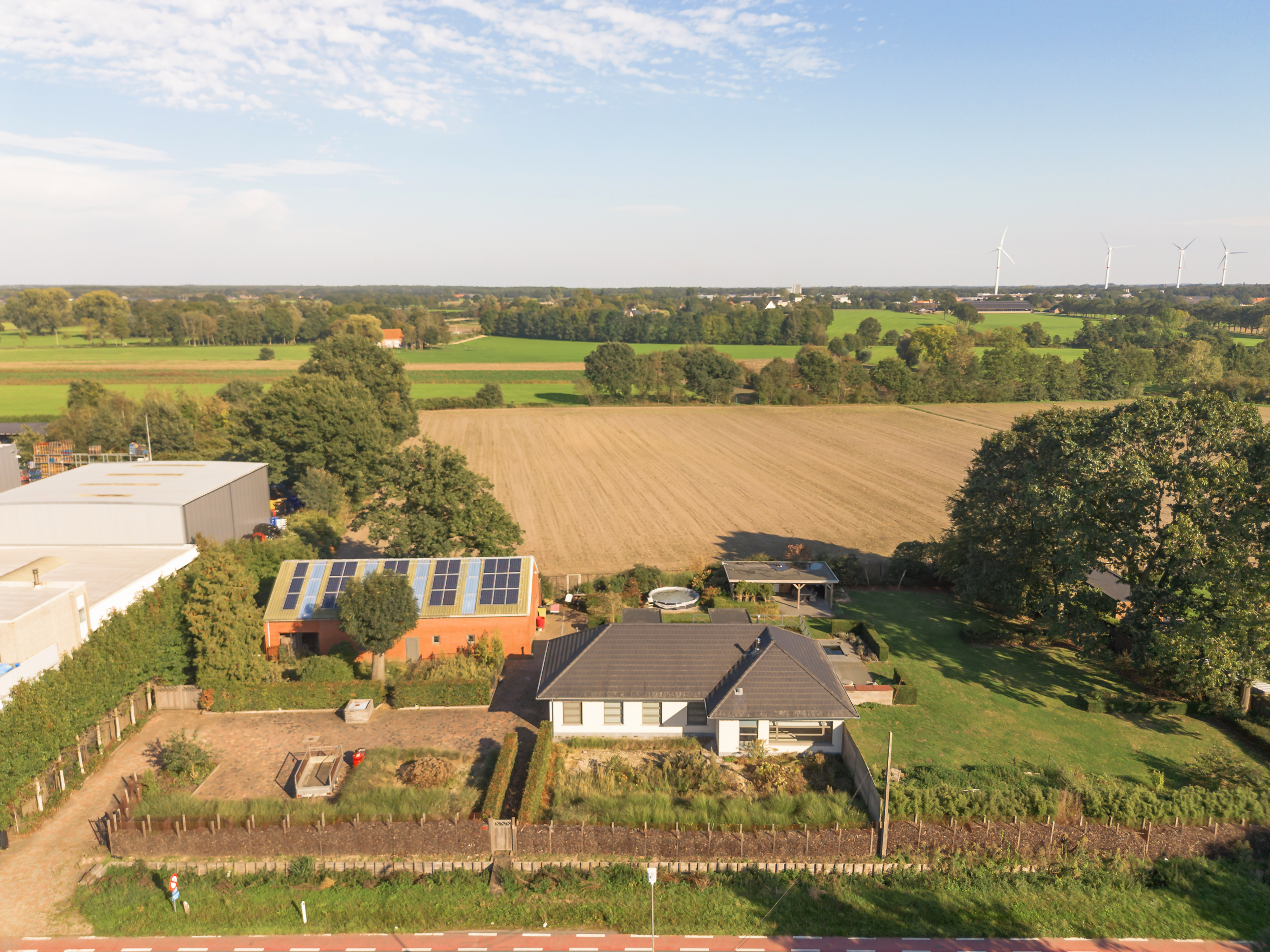 Move-in-ready renovated villa with permitted warehouse and stunning views over meadows!