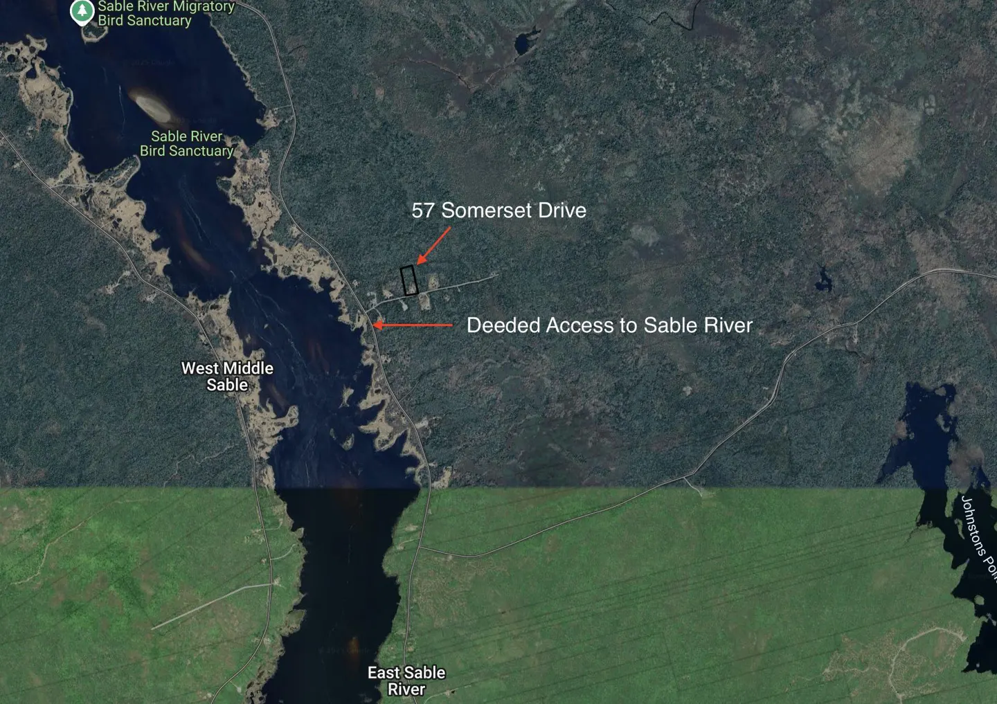 Aerial view of 57 Somerset Drive, near West Middle Sable River, with deeded river access. Forest and wetlands surround the property.