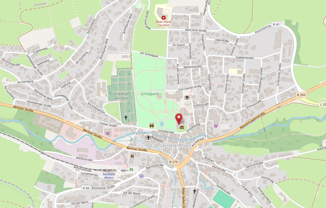 Map of Gersfeld (Rhön), Germany, showing streets, parks, and landmarks. A red marker indicates a specific location near Schloßpark.