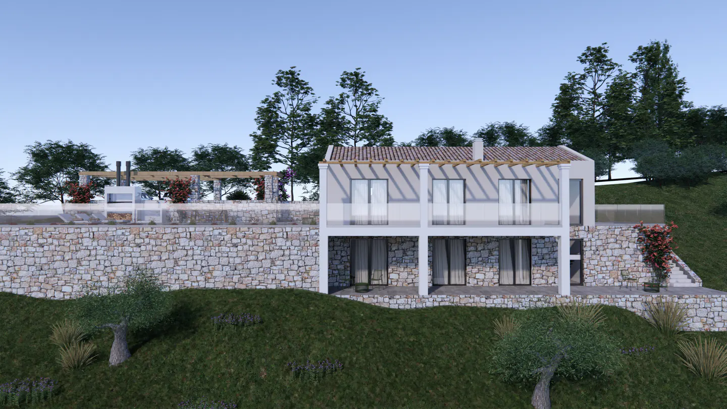 Two-story house with stone facade and white trim, built into a hillside with trees and blue sky.