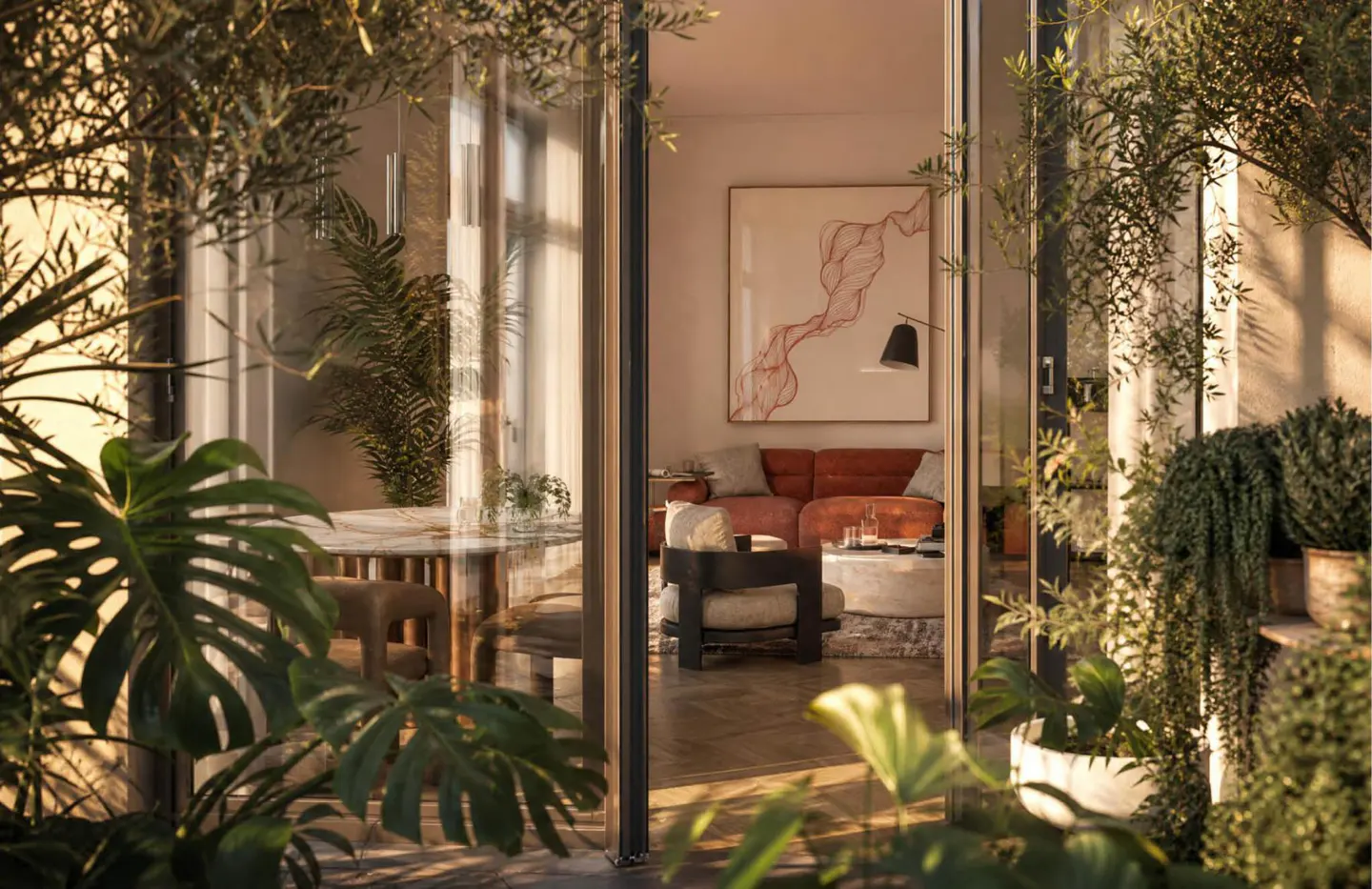View through a glass door into a warm, sunlit living room with a rust-colored sofa, modern armchair, and abstract art.