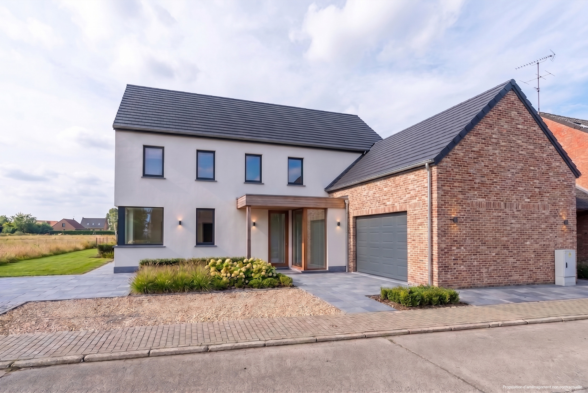 Two-story house with a gray roof, white stucco, and brick garage. A paved driveway leads to the gray garage door.