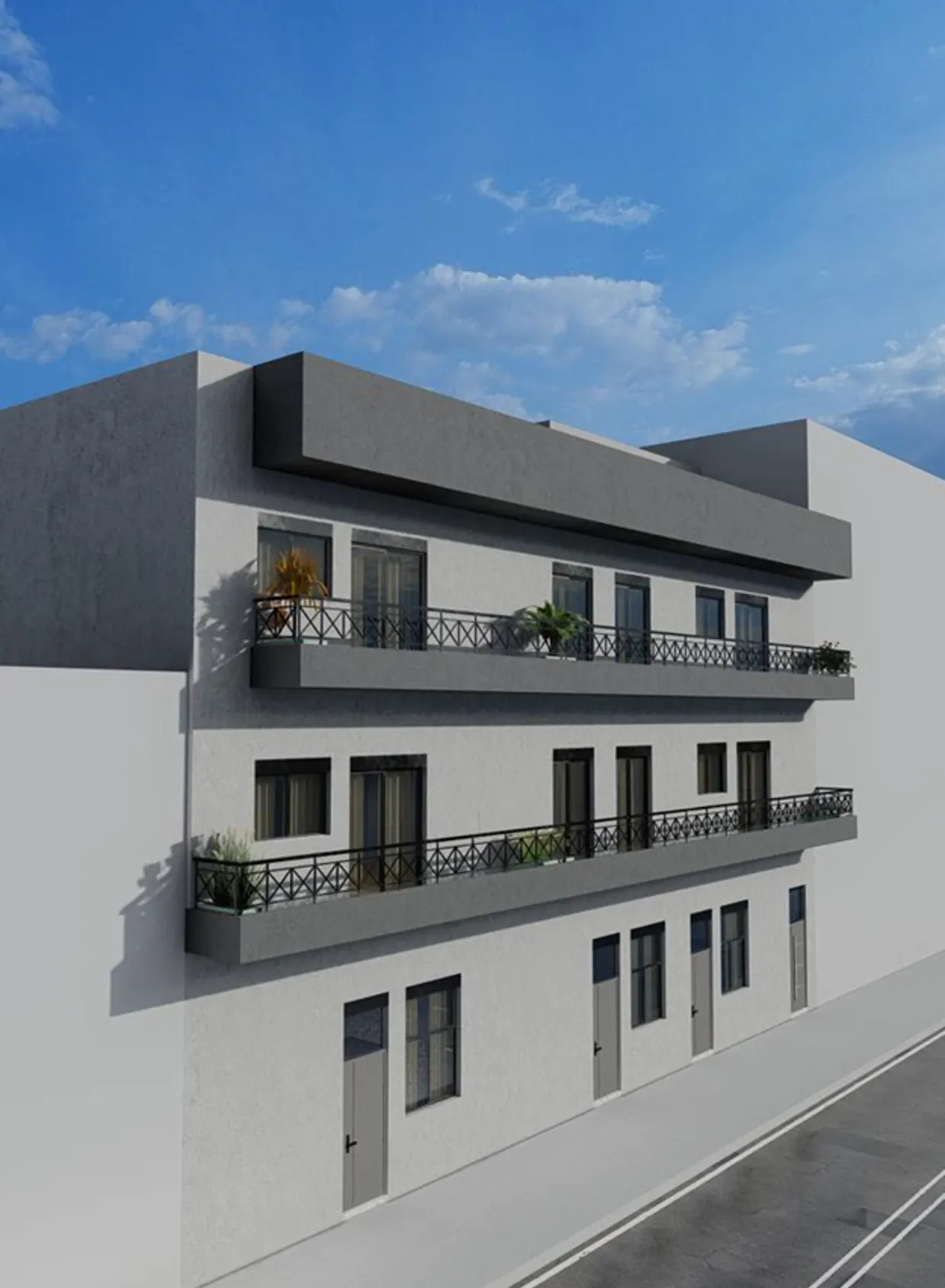 Modern, three-story apartment building with gray balconies and white facade under a blue sky.