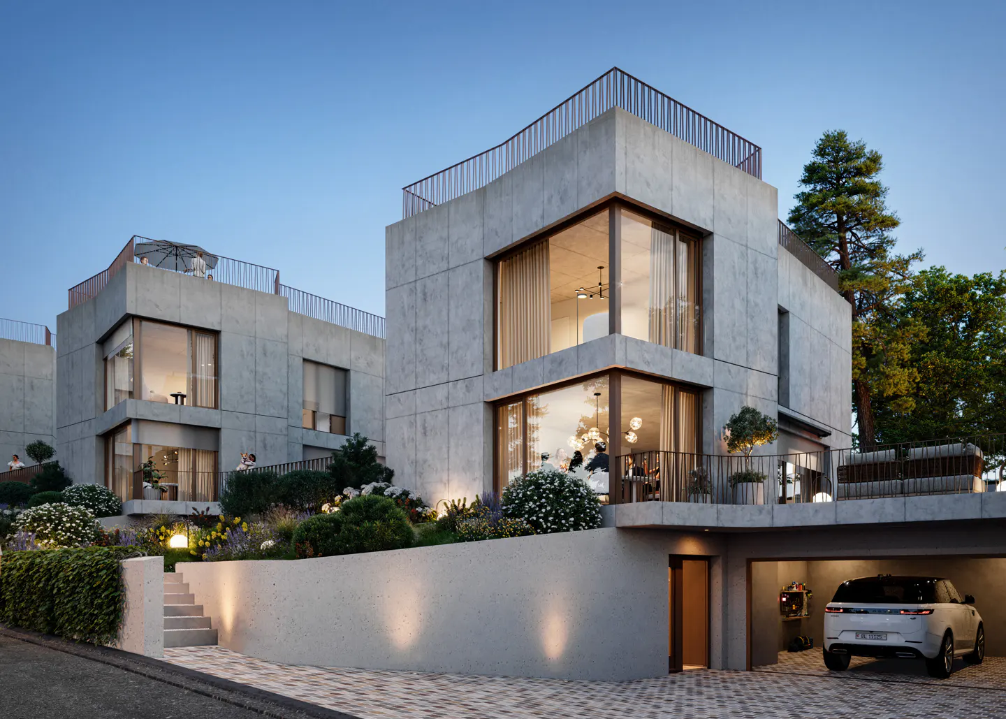 Modern concrete townhouses with large windows and rooftop terraces. A white SUV is parked in the garage. Landscaped garden in front.
