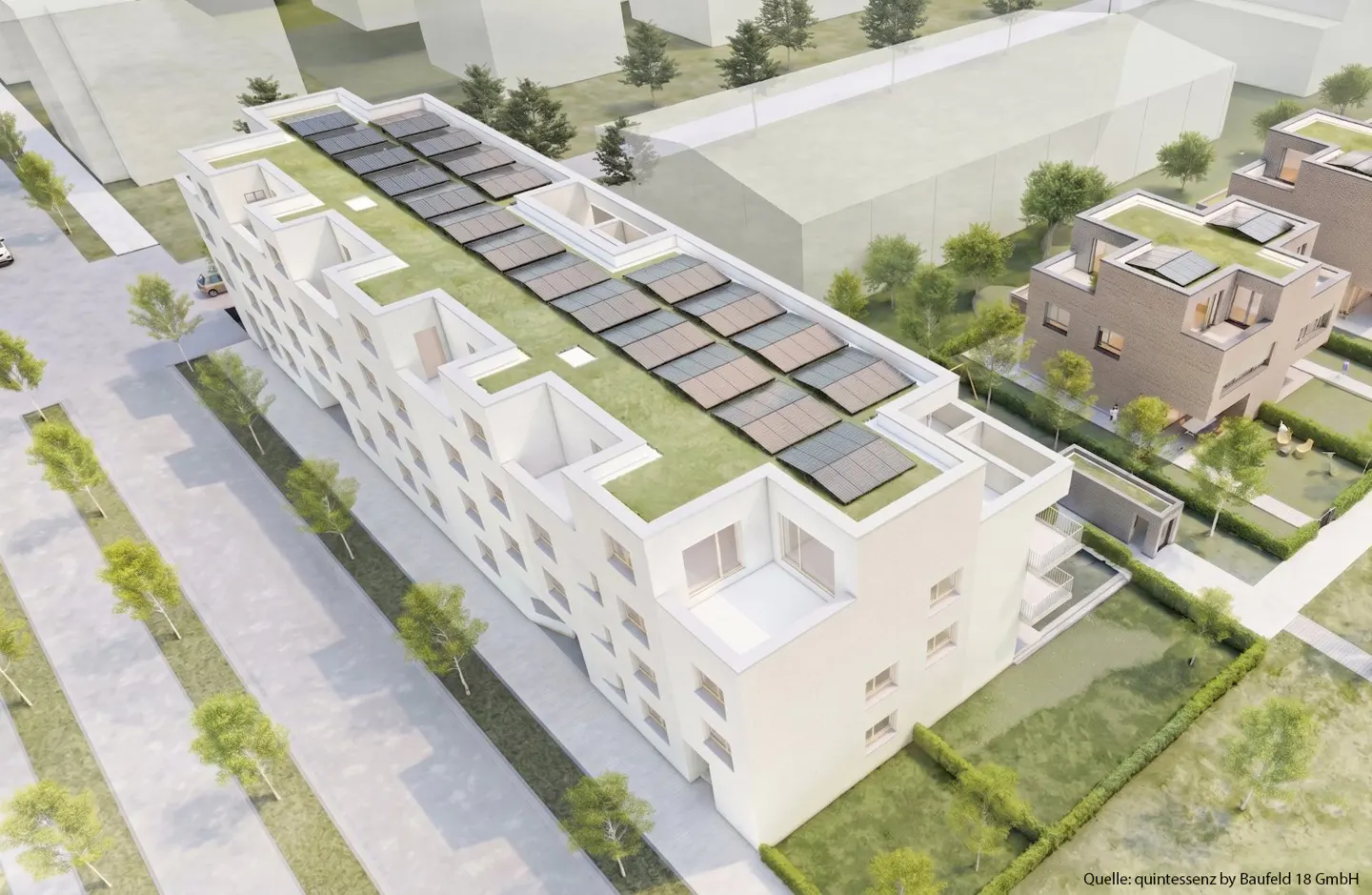 Aerial view of a modern, white apartment building with a green roof and solar panels. Trees line the street.