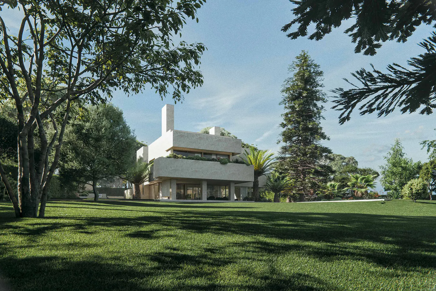 Modern, light-stone house with a flat roof, surrounded by green lawn and trees under a blue sky.