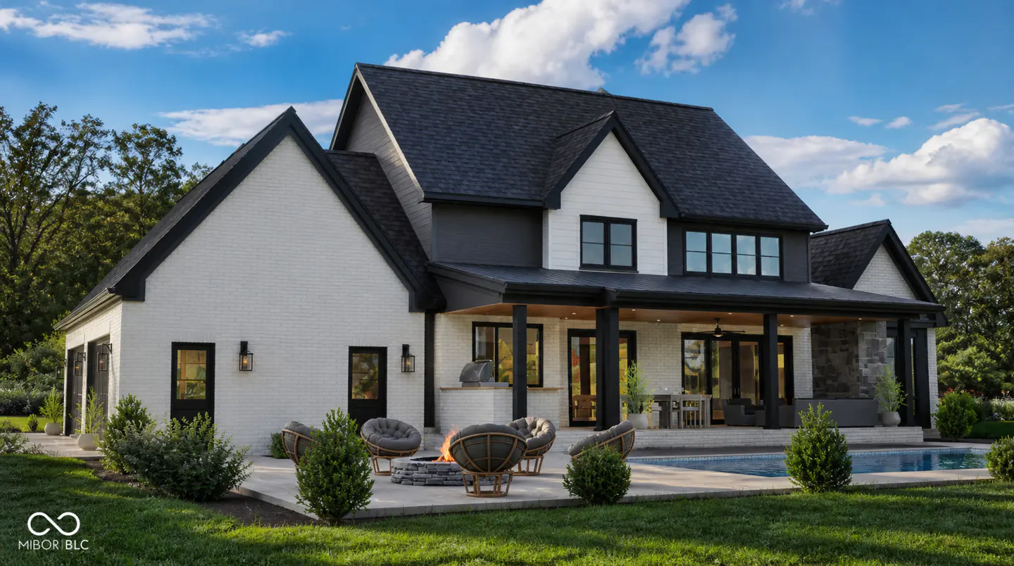 Exterior view of a two-story white brick house with a black roof, a patio with a fire pit, and a pool.
