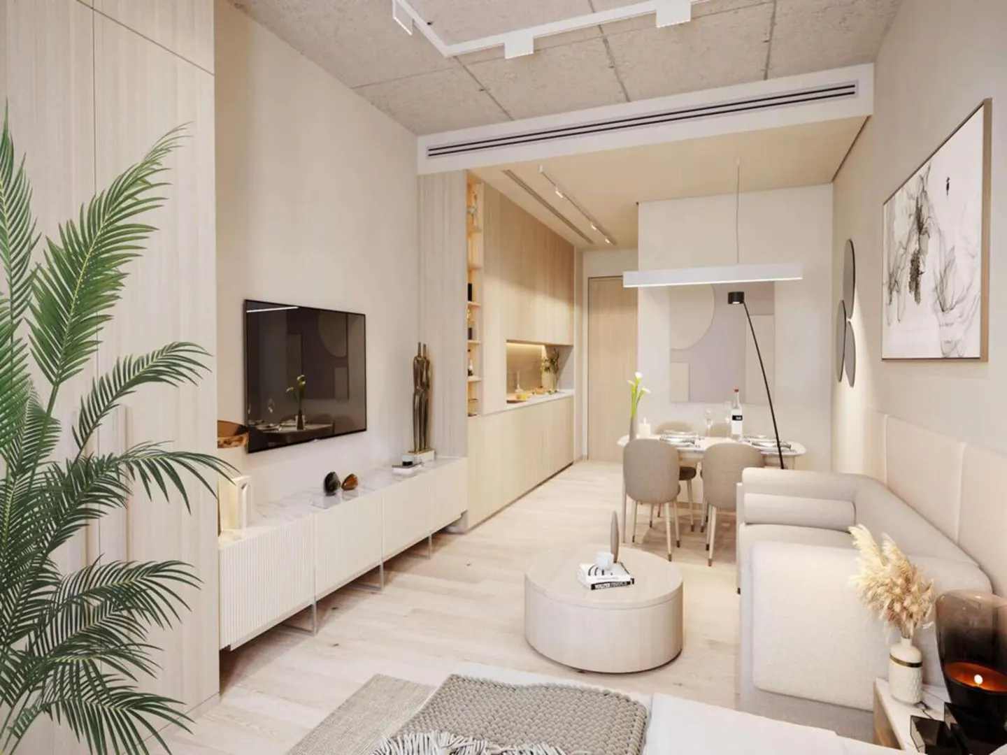A bright, modern apartment interior with a TV, dining table, sofa, and kitchen area. The color palette is neutral with light wood and white tones.
