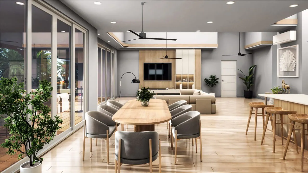 Open-concept living space with a wood dining table, gray chairs, and a tan sectional sofa. Large windows and wood floors.