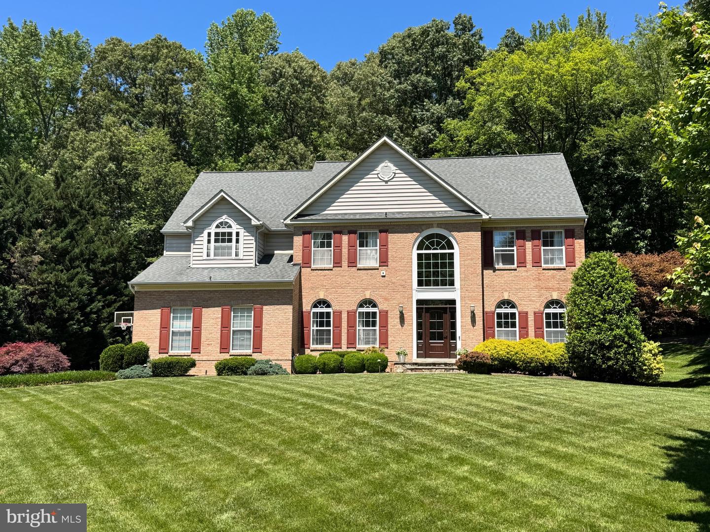 Classic Brick-Front Colonial with Exceptional Outdoor Living