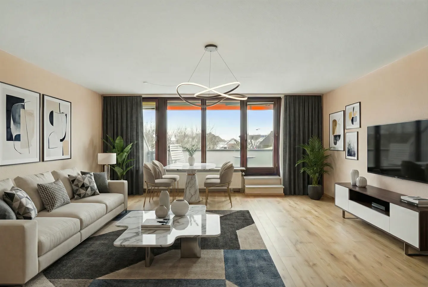 Bright living room with beige walls, wood floors, and a large window. A white sofa, marble table, and dining set furnish the space.