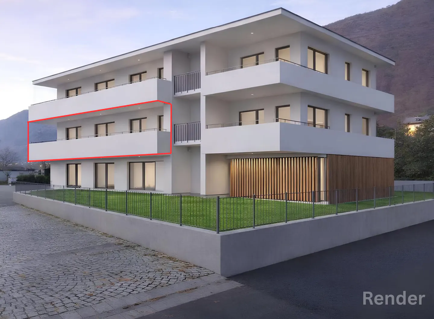 Exterior view of a modern, three-story white apartment building with balconies, green lawn, and a mountain backdrop.
