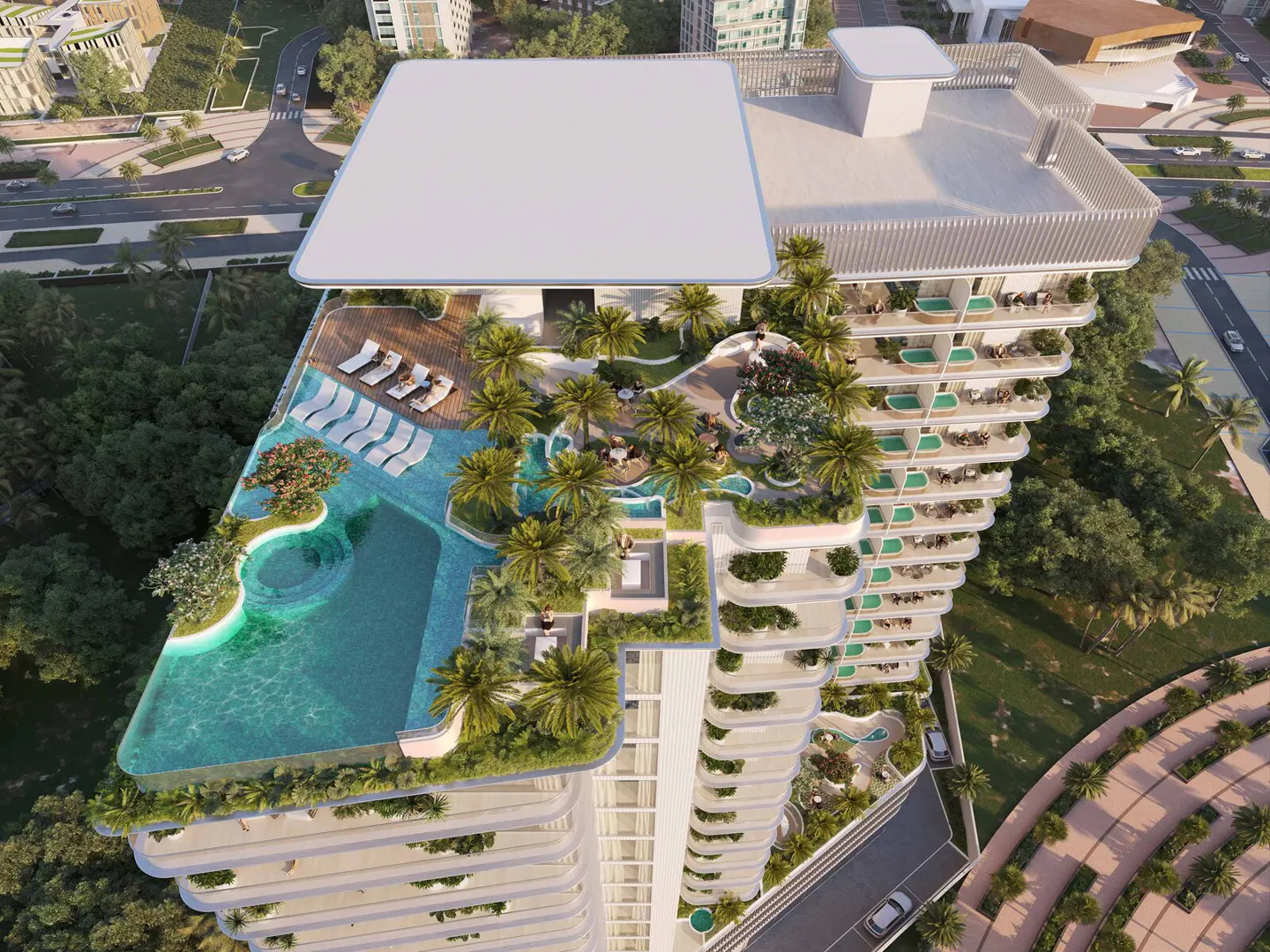 Aerial view of a modern high-rise building with a rooftop infinity pool, lush landscaping, and lounge chairs.