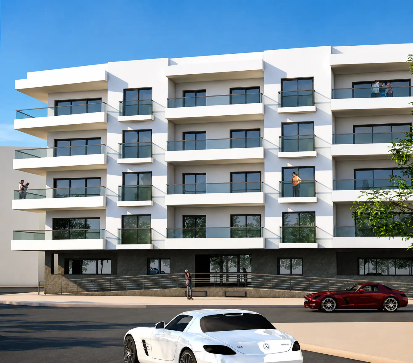Modern white apartment building with balconies, people on terraces, and luxury cars parked on the street in front.