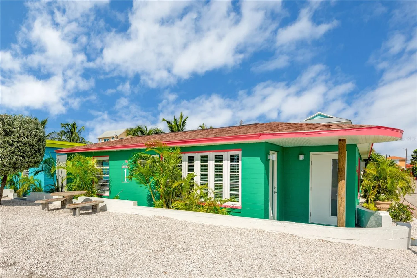 Brightly Colored Cottage with Across from Sunset Beach