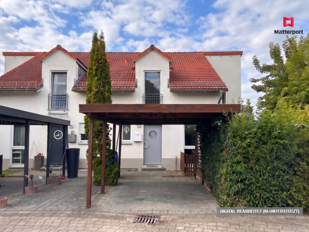 White two-story house with a red tiled roof, a wooden carport, and a paved driveway under a blue sky with light clouds. [AI-generated text]