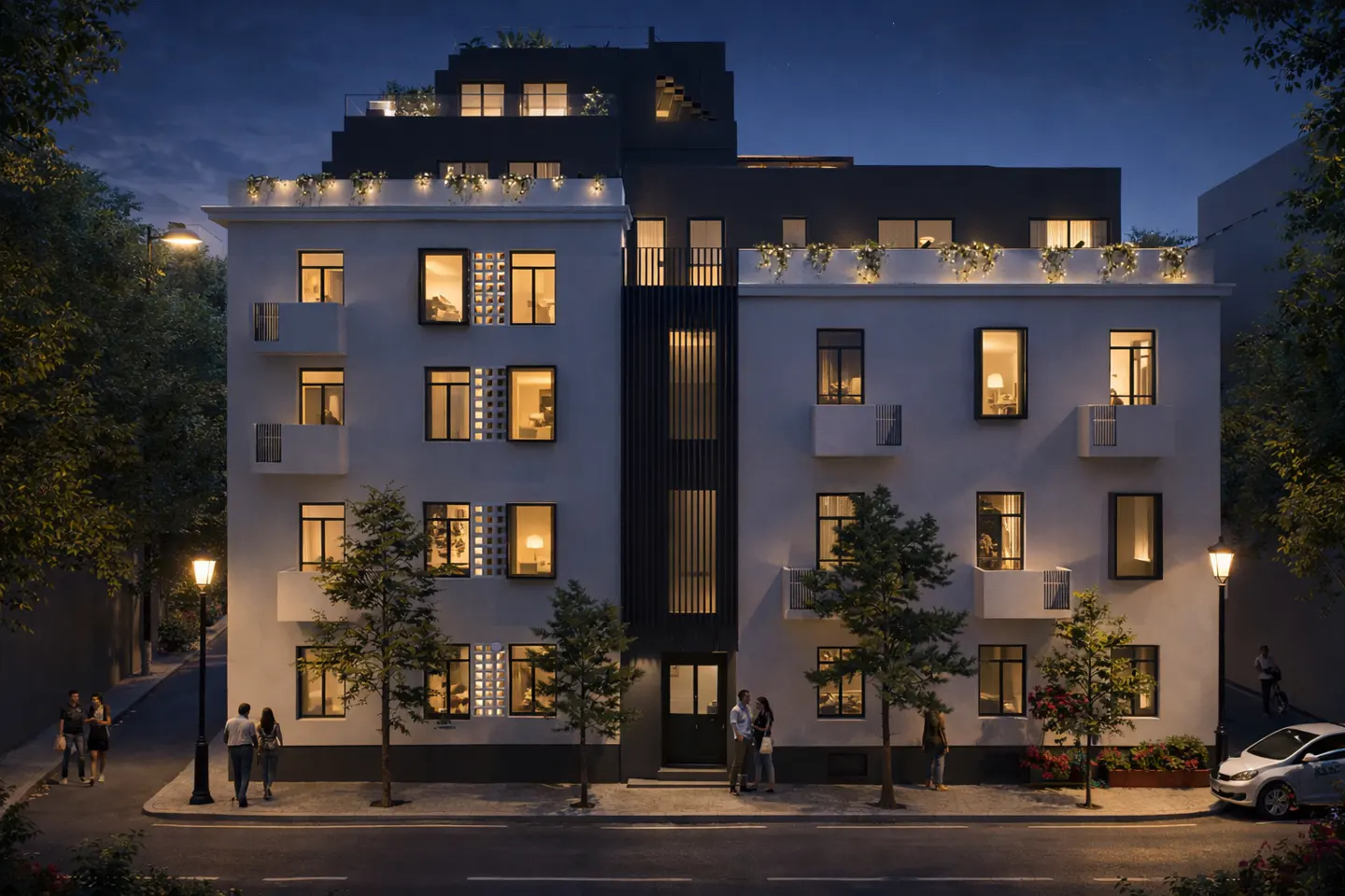 Exterior view of a white, multi-story apartment building at dusk with lit windows and greenery on the roof.
