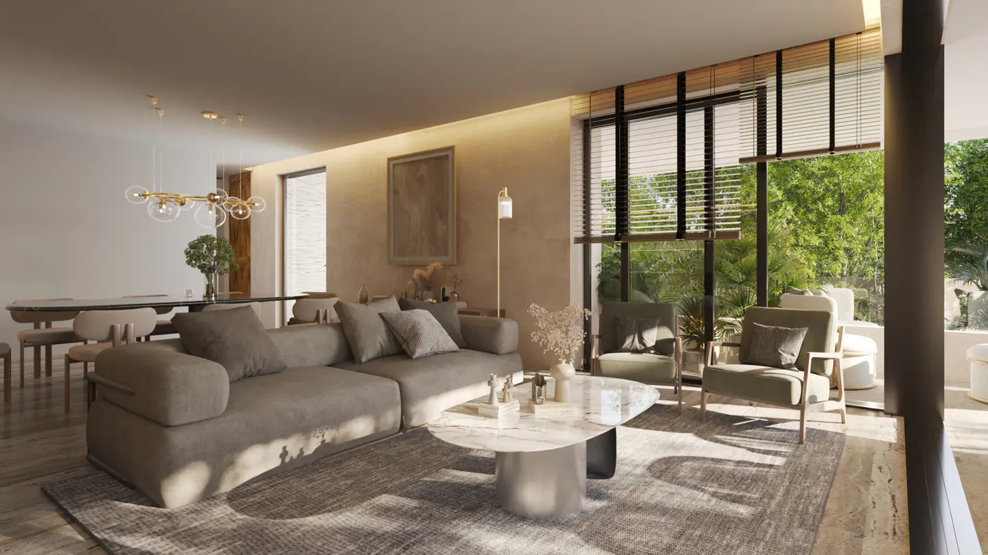 A bright living room with a gray sofa, marble table, and two green armchairs facing a window with green trees outside.