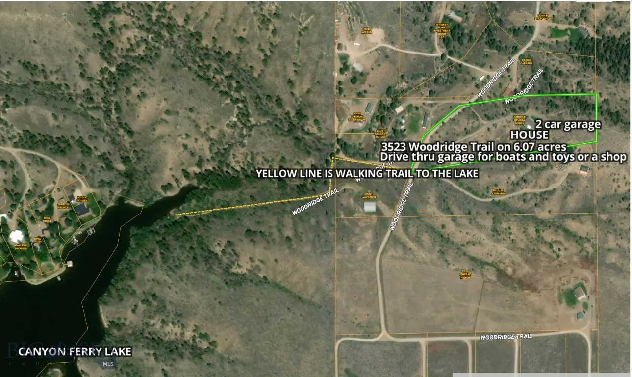 Aerial view of a house on 6 acres near Canyon Ferry Lake, with a yellow walking trail to the lake. The house has a 2-car garage.