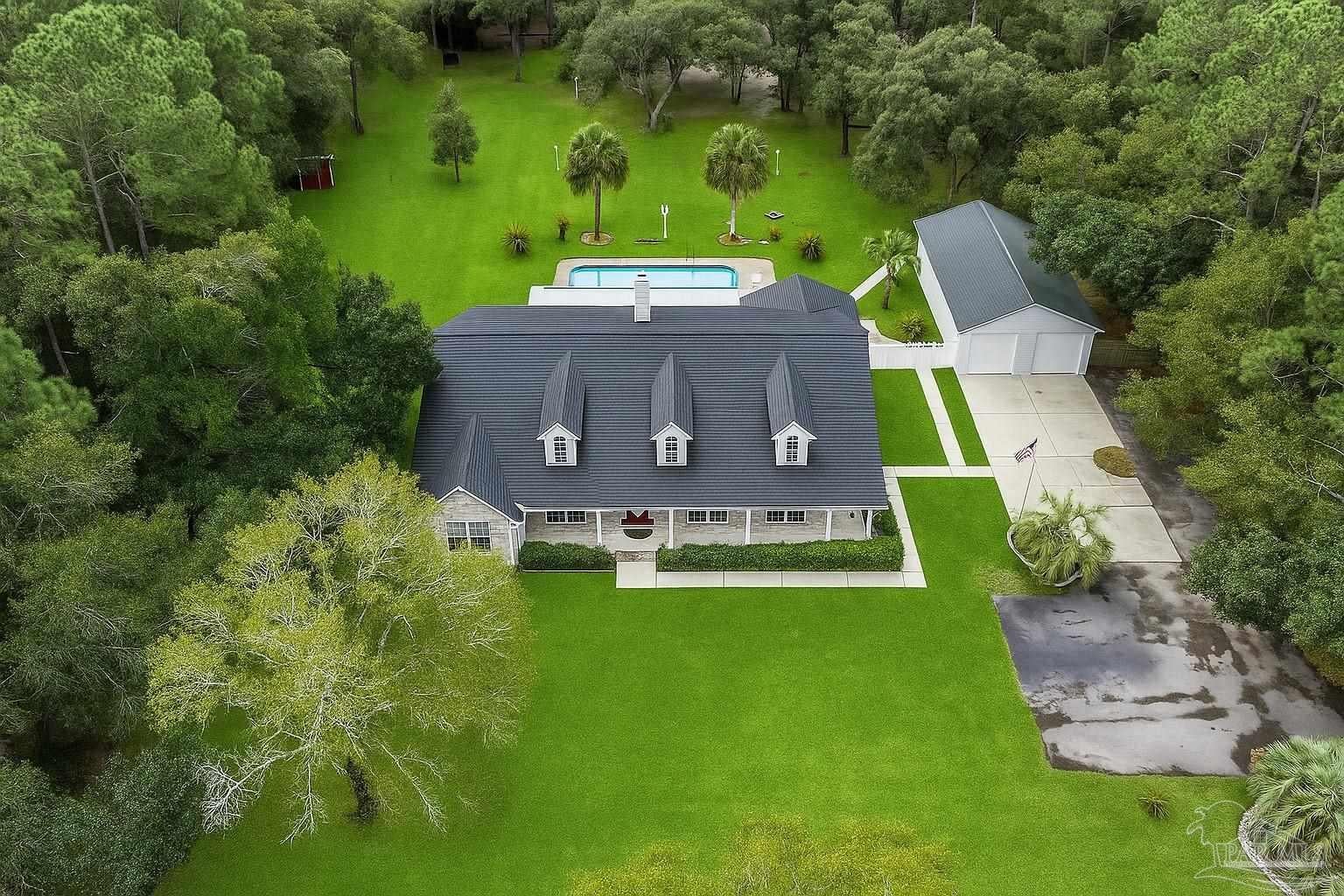 Live the Florida Dream in a Private 4-Acre Oasis with a Pool