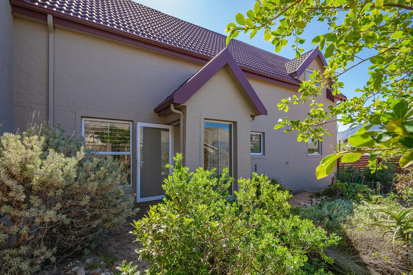 A welcoming front door offering direct access to the light and spacious living area