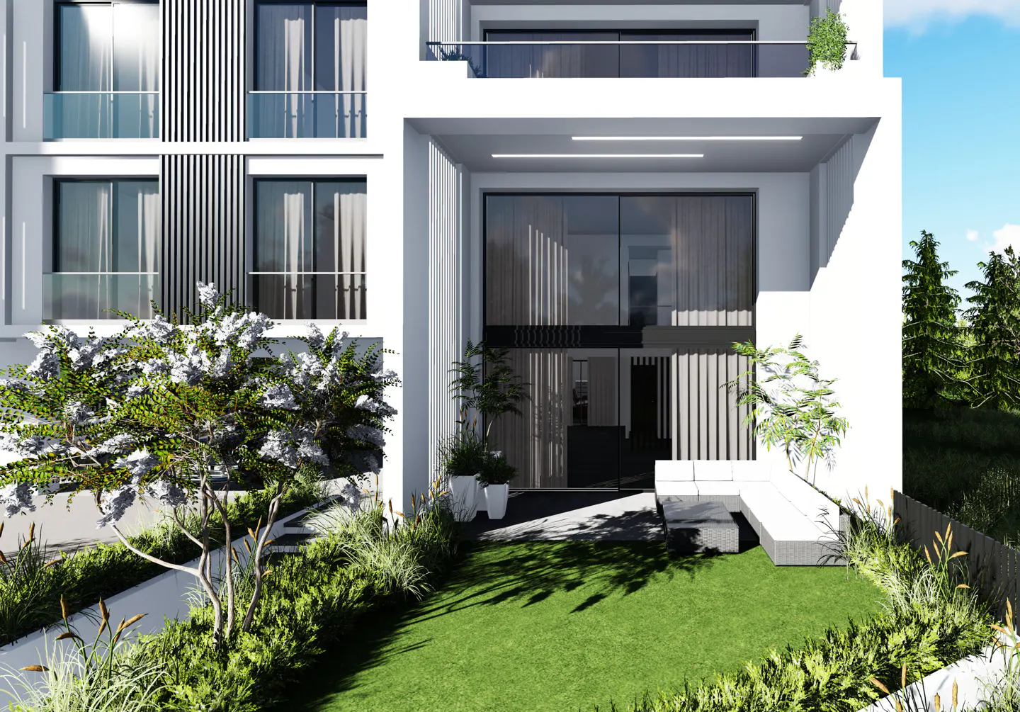 Modern white building with large windows and a green lawn. A white sofa sits on the lawn near the building's entrance.