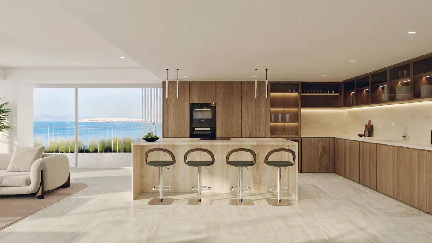 Bright, modern kitchen with wood cabinets, island with four stools, and ocean view through a large window.