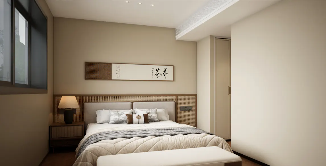 A bedroom with a bed, nightstand, lamp, and a bench at the foot of the bed. A picture hangs above the bed.