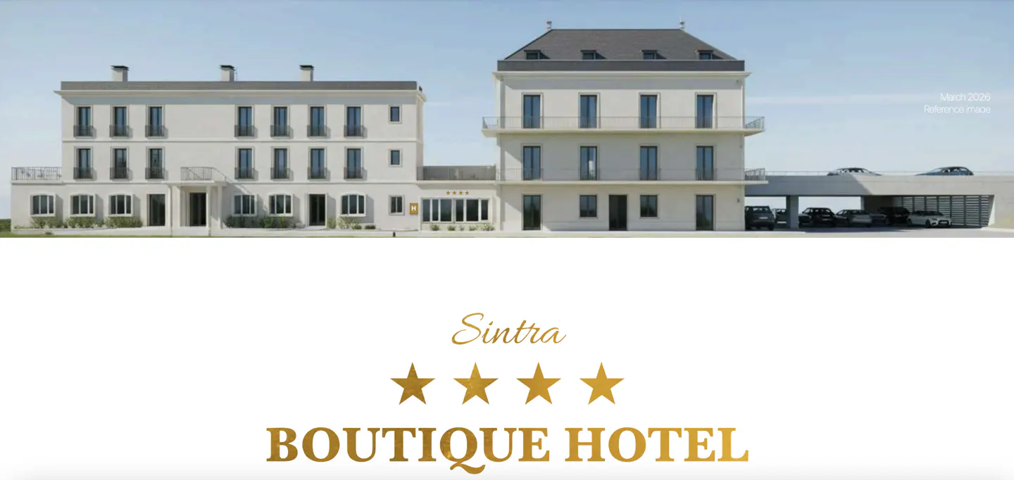 Facade of the Sintra Boutique Hotel, a four-star hotel, with a parking garage.