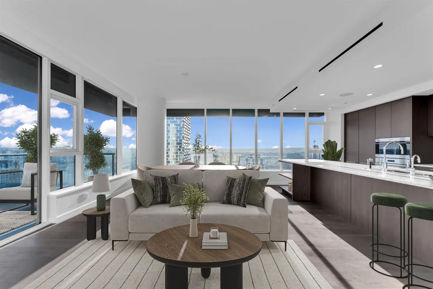 Bright, modern condo interior with a beige sofa, wood coffee table, and city views from large windows. Kitchen island and stools visible.