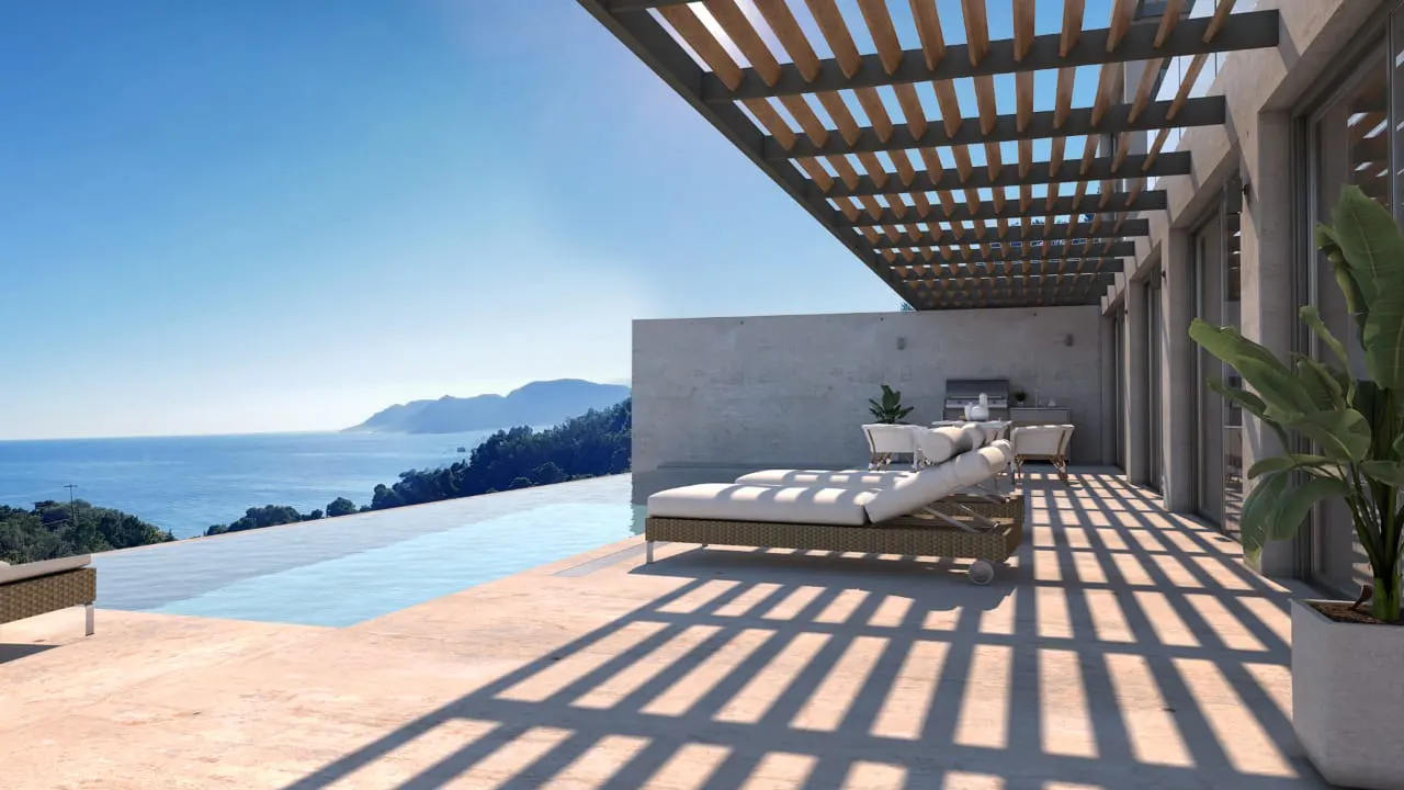 Luxury patio with infinity pool overlooking the ocean. Lounge chairs sit under a pergola casting shadows on the stone floor.