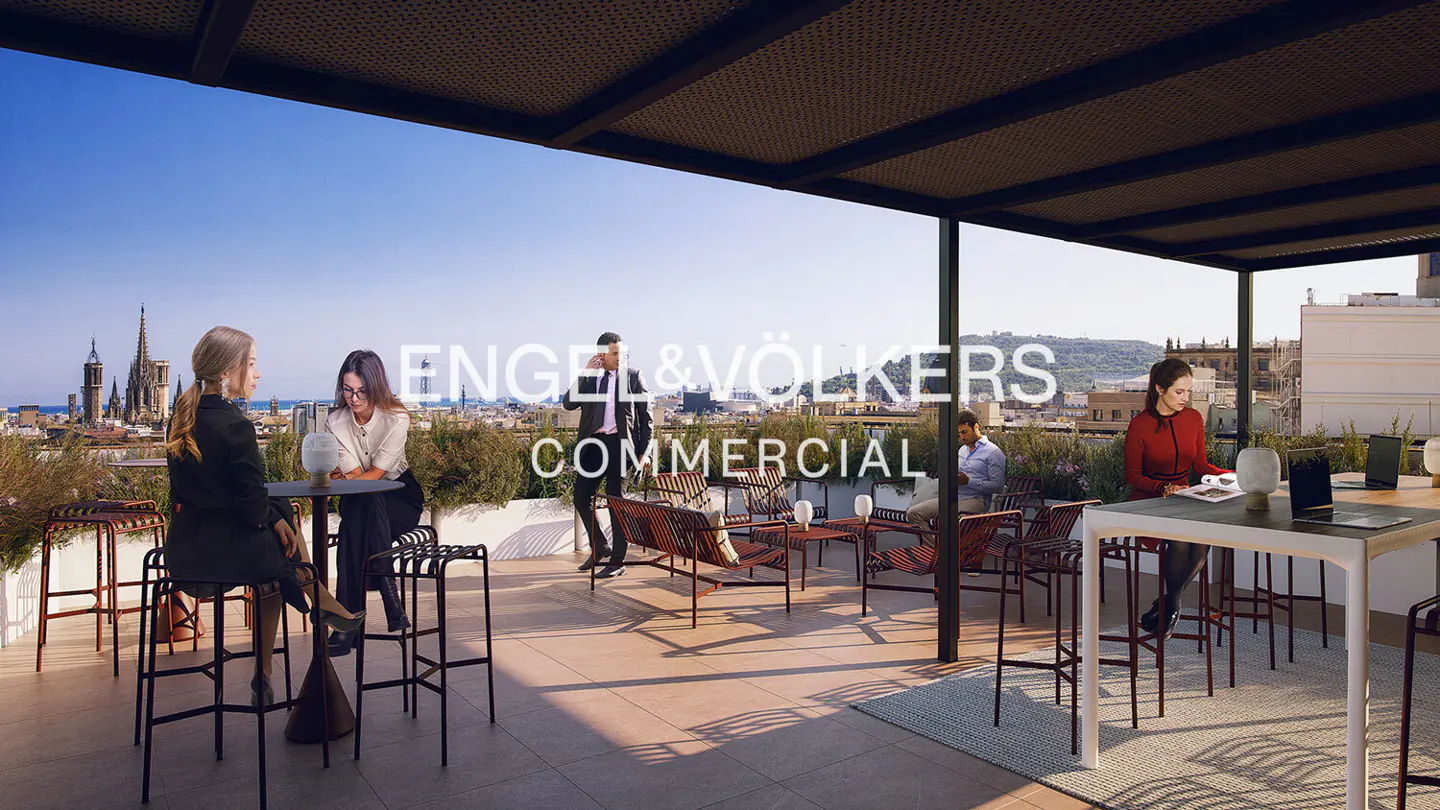 Engel & Völkers Commercial rooftop terrace with people, tables, and chairs. Barcelona cityscape in the background.
