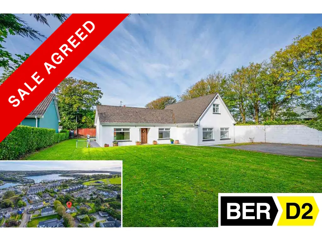 White bungalow with a large green lawn, a "Sale Agreed" banner, and an inset aerial view of the coastal neighborhood.