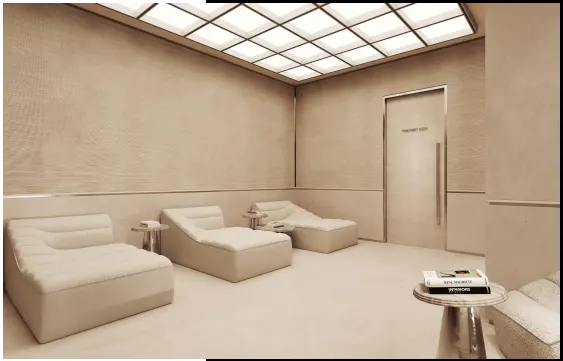 Modern spa lounge with beige textured walls, three plush lounge chairs, small side tables, and a grid-patterned ceiling.
