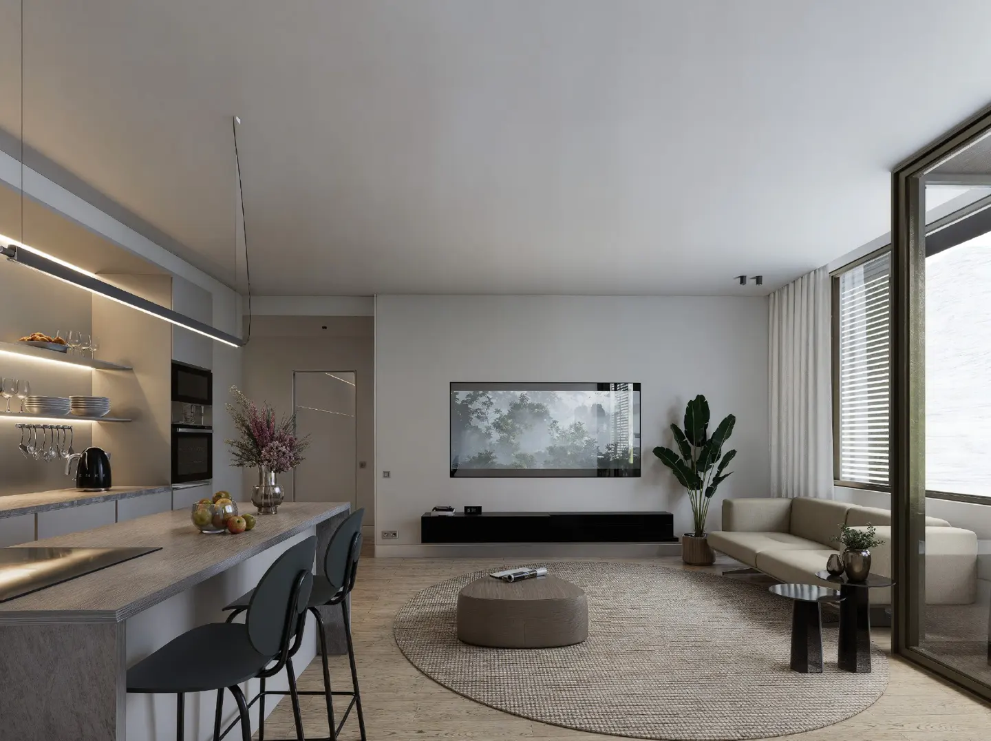 Open-concept living space with a kitchen island, bar stools, sofa, and large TV. Neutral color palette.