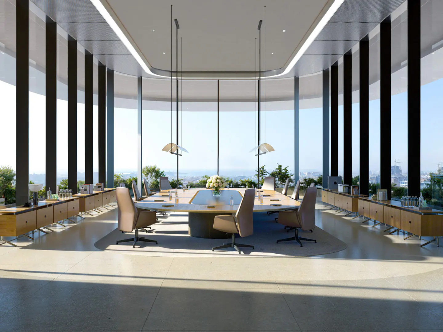 Modern boardroom with a large oval table, tan leather chairs, and floor-to-ceiling windows overlooking a city skyline.
