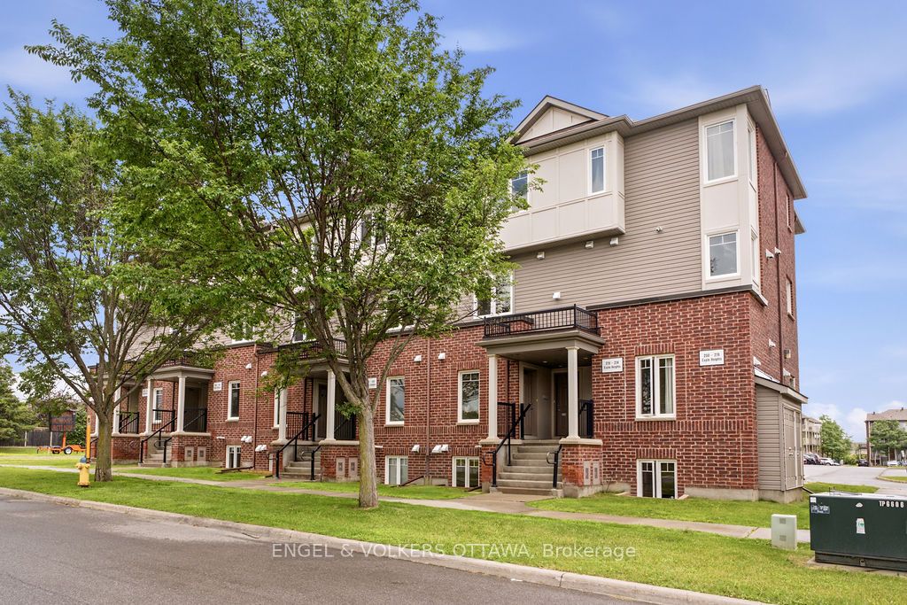 Townhouse  offering 2 parking with low maintenance living