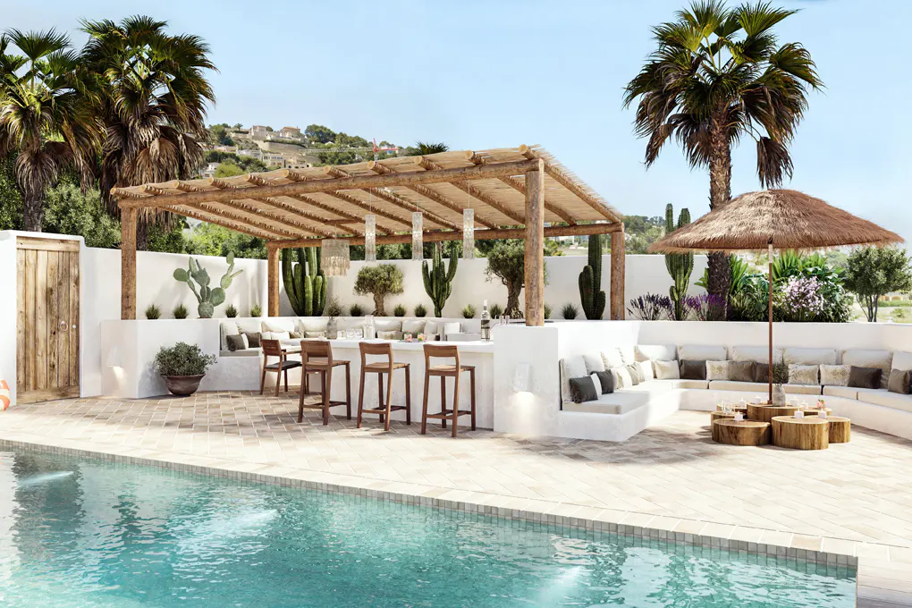 Outdoor patio with pool, bar, and seating area. White walls, wood pergola, palm trees, and cacti.