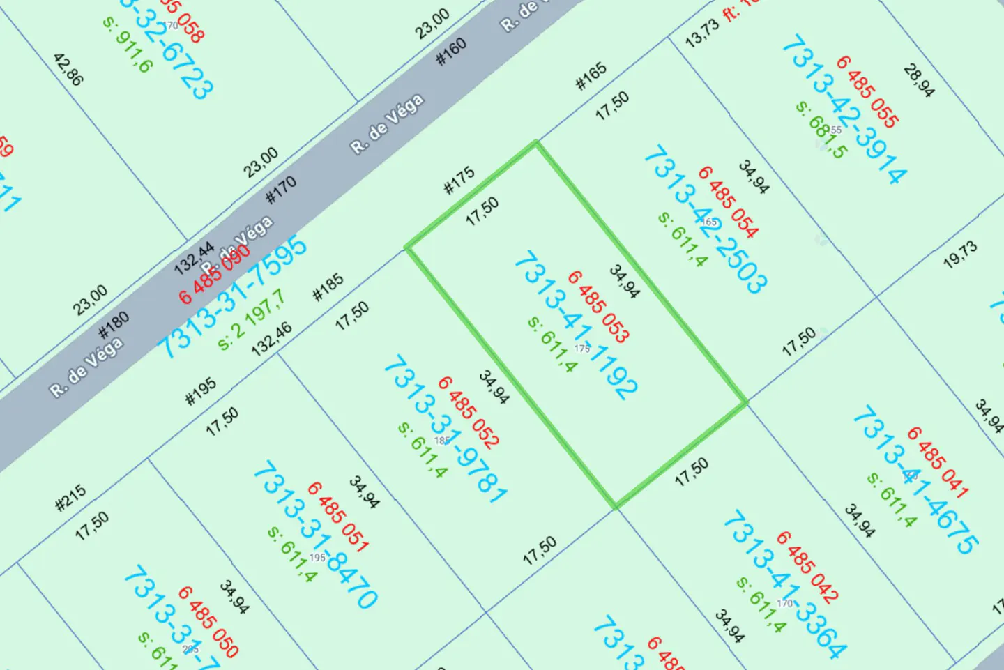 Real estate map showing a property outlined in green, with parcel numbers and dimensions.