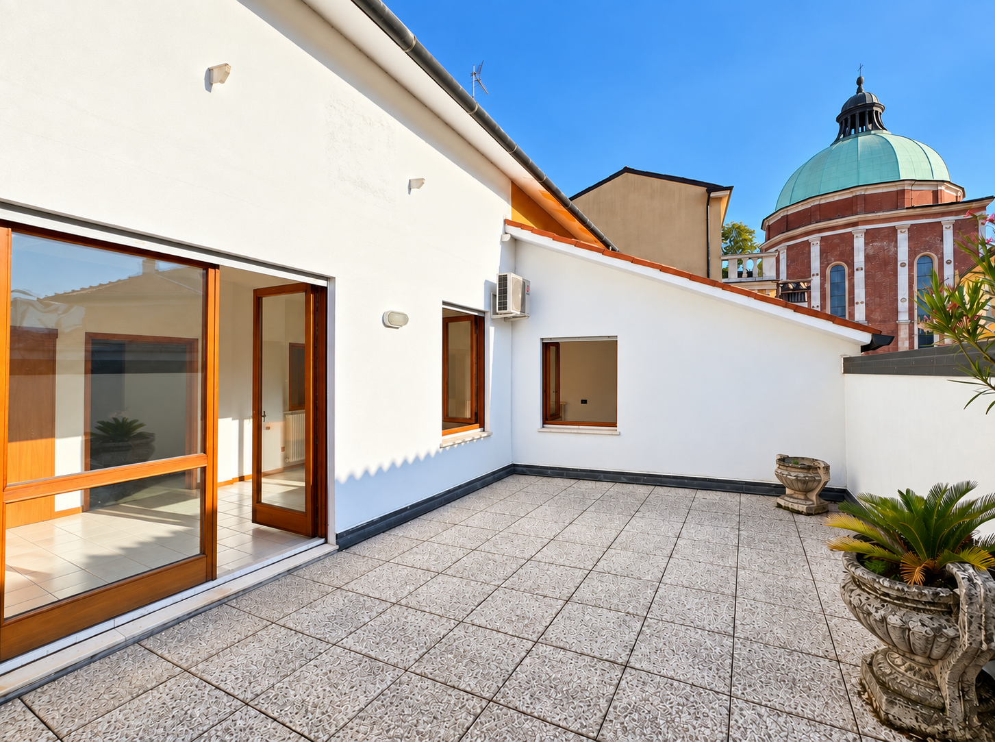 Top floor with terrace and views of Vicenza Cathedral’s dome