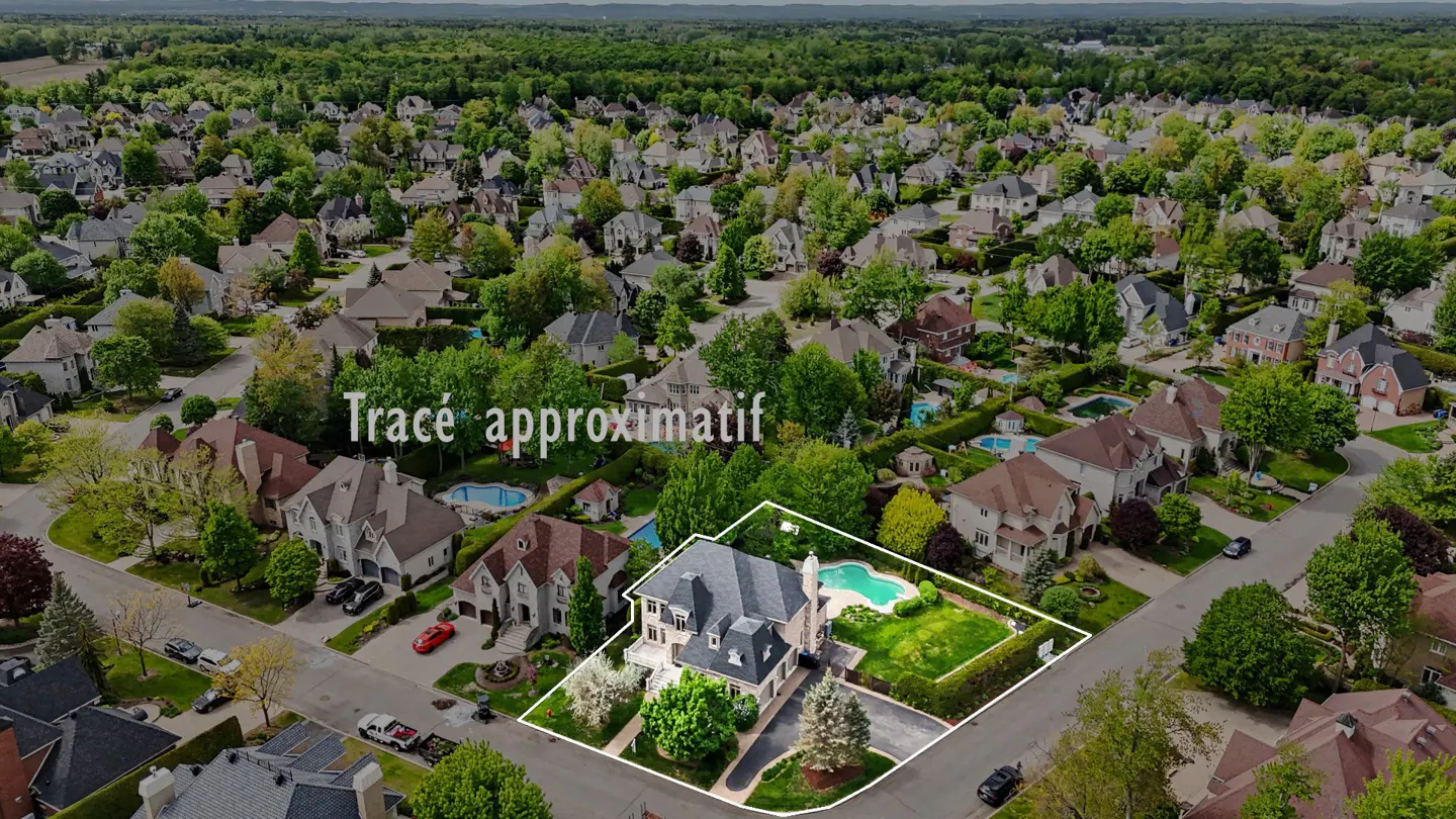 Aerial view of a large, grey-roofed house with a pool, outlined in white, in a lush, green suburban neighborhood.