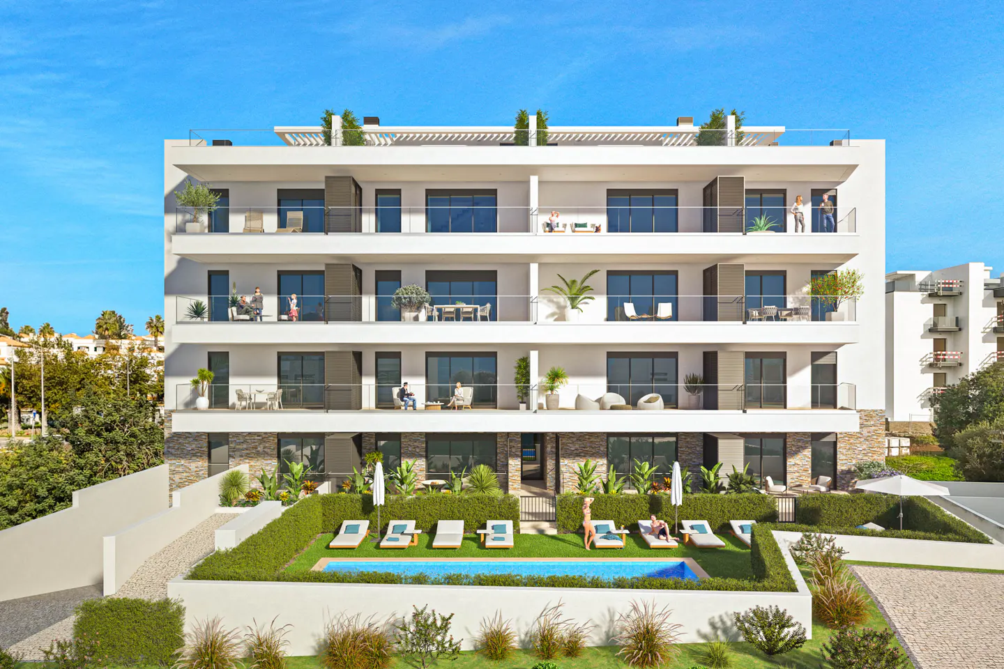 Modern white apartment building with balconies, a pool, and lounge chairs on a sunny day.