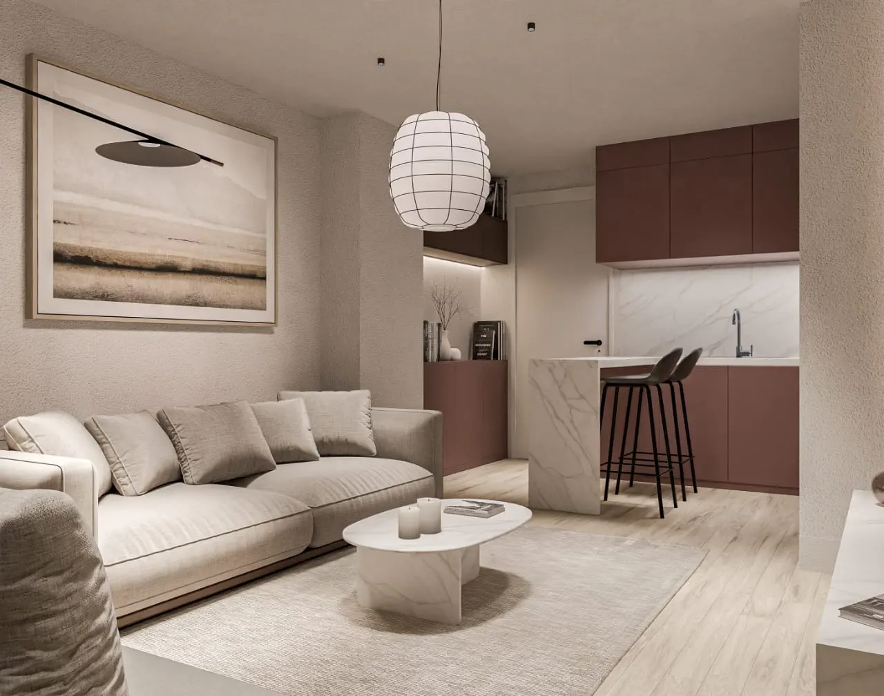 A modern apartment interior with a beige sofa, marble coffee table, and open kitchen with maroon cabinets. A large landscape painting hangs above the sofa.