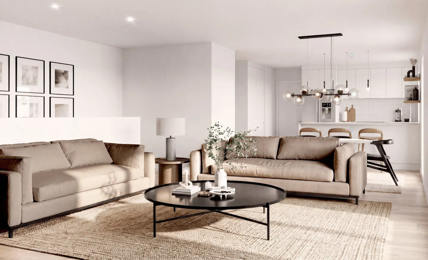 Bright, modern living room with beige sofas, black coffee table, and jute rug. White kitchen in background with pendant lighting.
