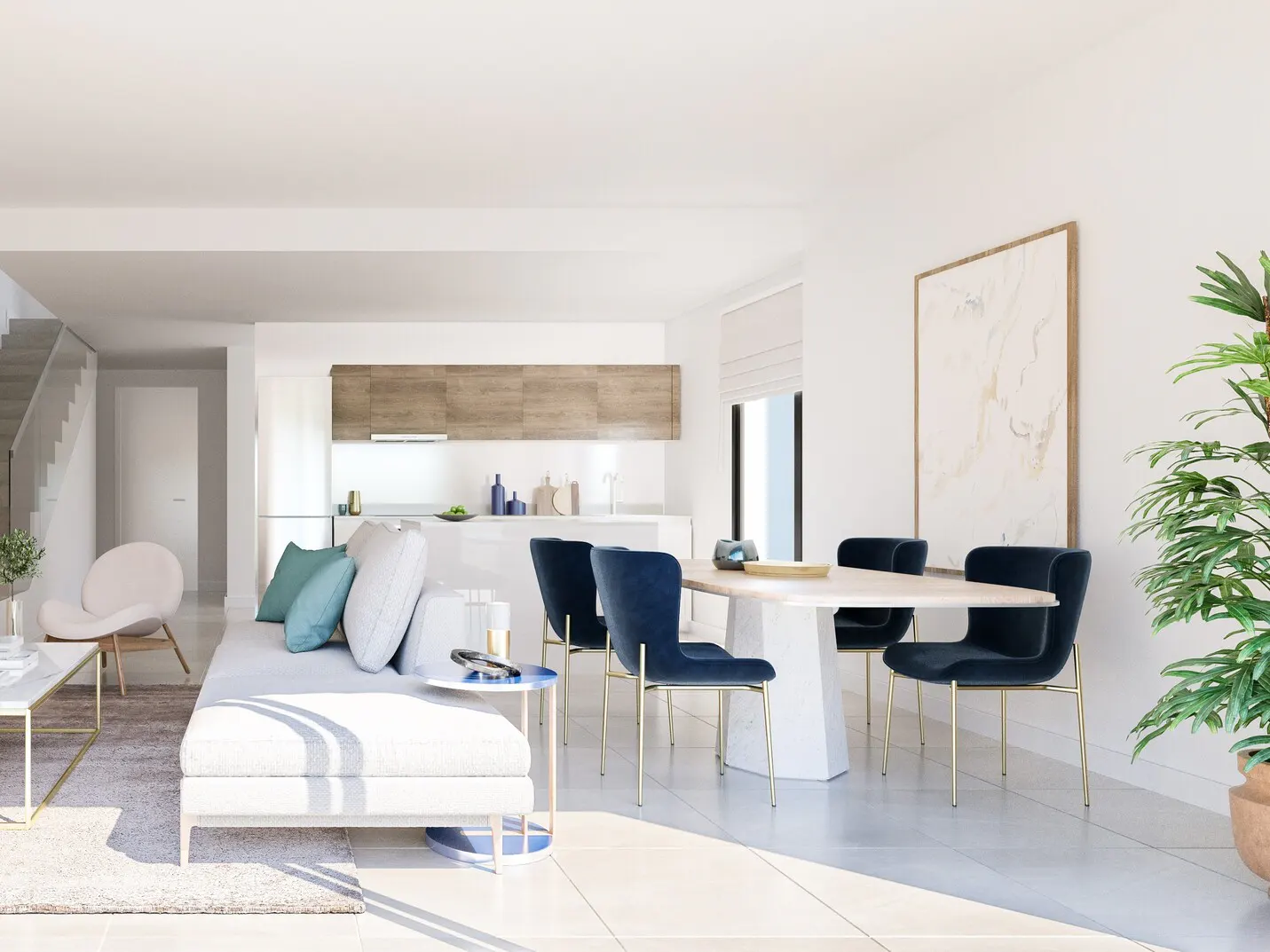 Bright, modern living space with a white sofa, blue chairs around a marble table, and a sleek kitchen in the background.