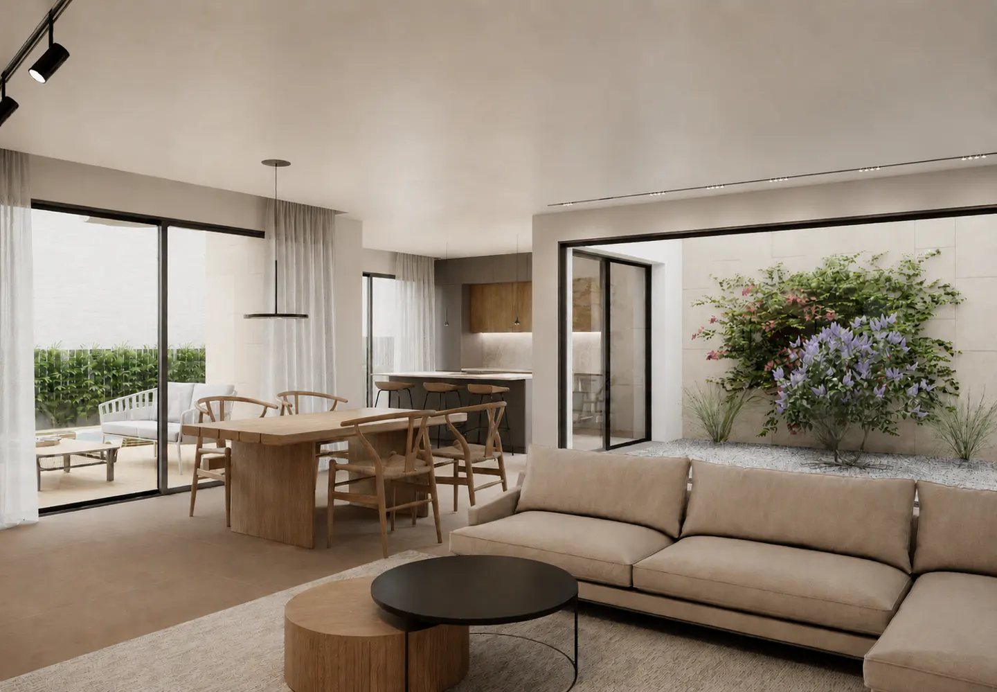 A bright, modern living space with a beige sectional sofa, wooden table and chairs, and an outdoor patio with greenery.