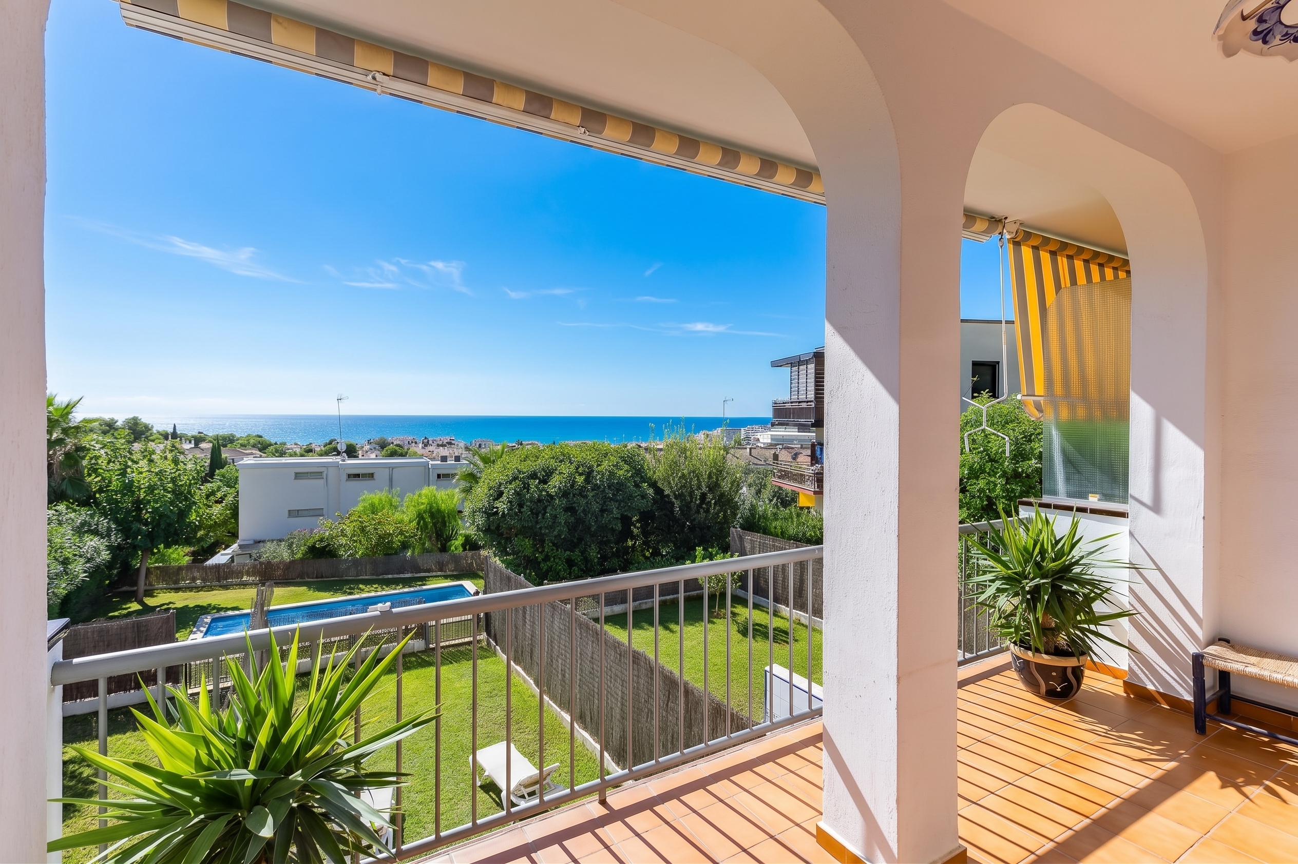 Bright home with magnificent sea views, private garden, and communal pool [AI-modified]