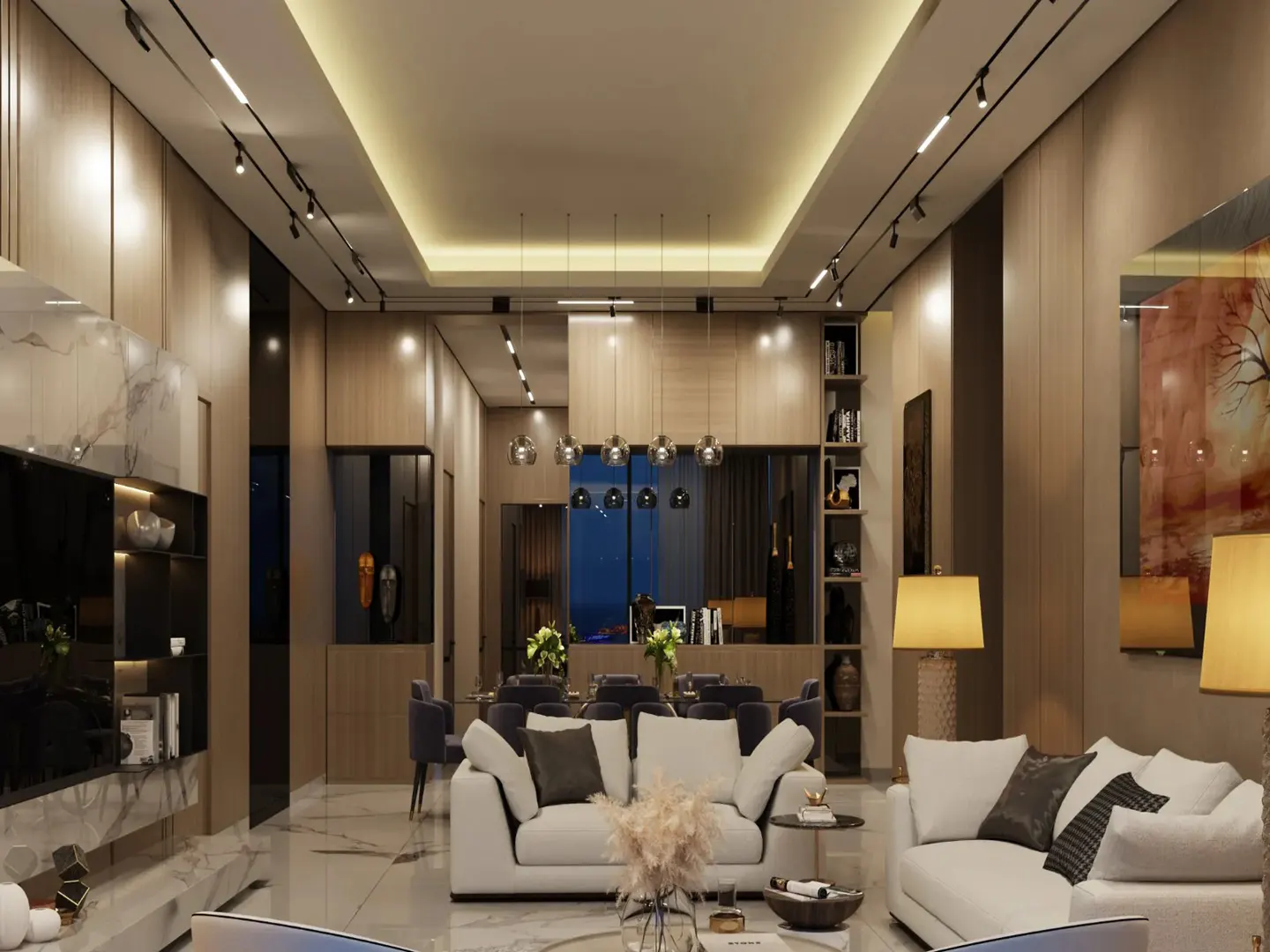 A modern living room with white sofas, a dining table, and wood paneling. Track lighting illuminates the space.