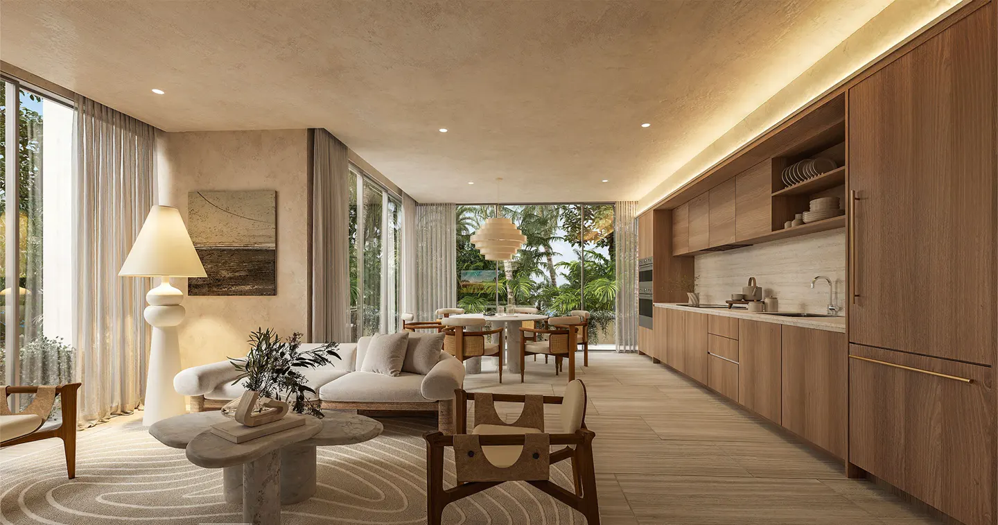 Modern open-plan kitchen and living area with wood cabinetry, beige sofa, stone coffee table, and floor-to-ceiling windows.