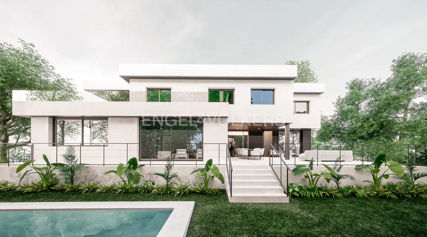 Modern white two-story house with a pool, green lawn, and tropical plants. A person stands on the patio.